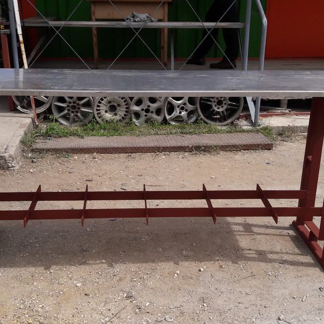 Red steel table fabricated in the shop