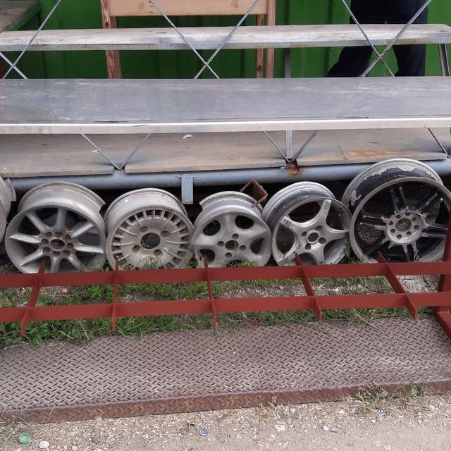 Steel table with rims stored below